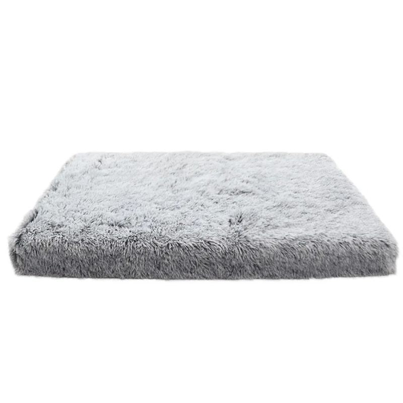 Gray fluffy pet bed on a white background