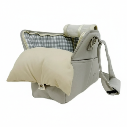 Baby carrier with beige and plaid interior on a white background