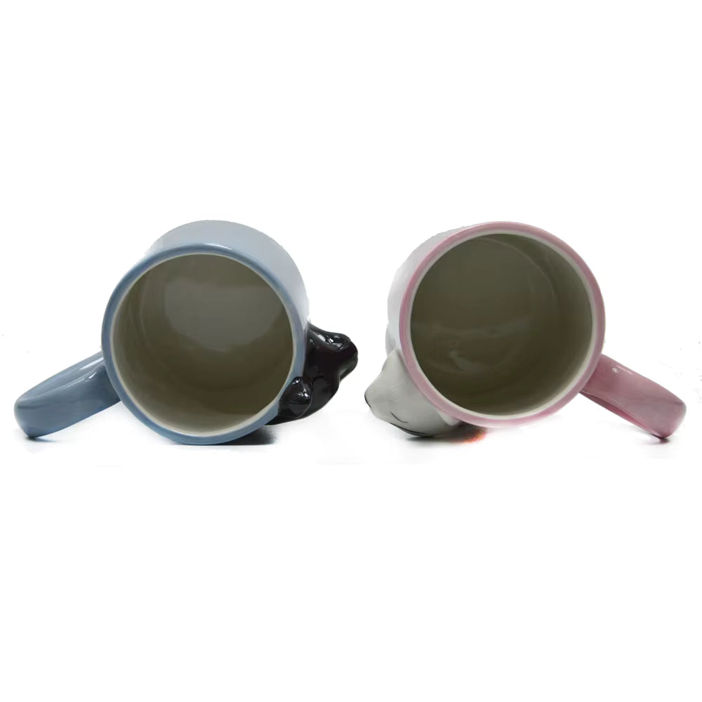 Two ceramic mugs with handles on a white background