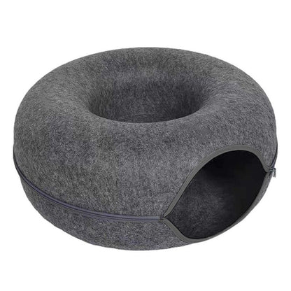 Gray donut-shaped pet bed on a white background