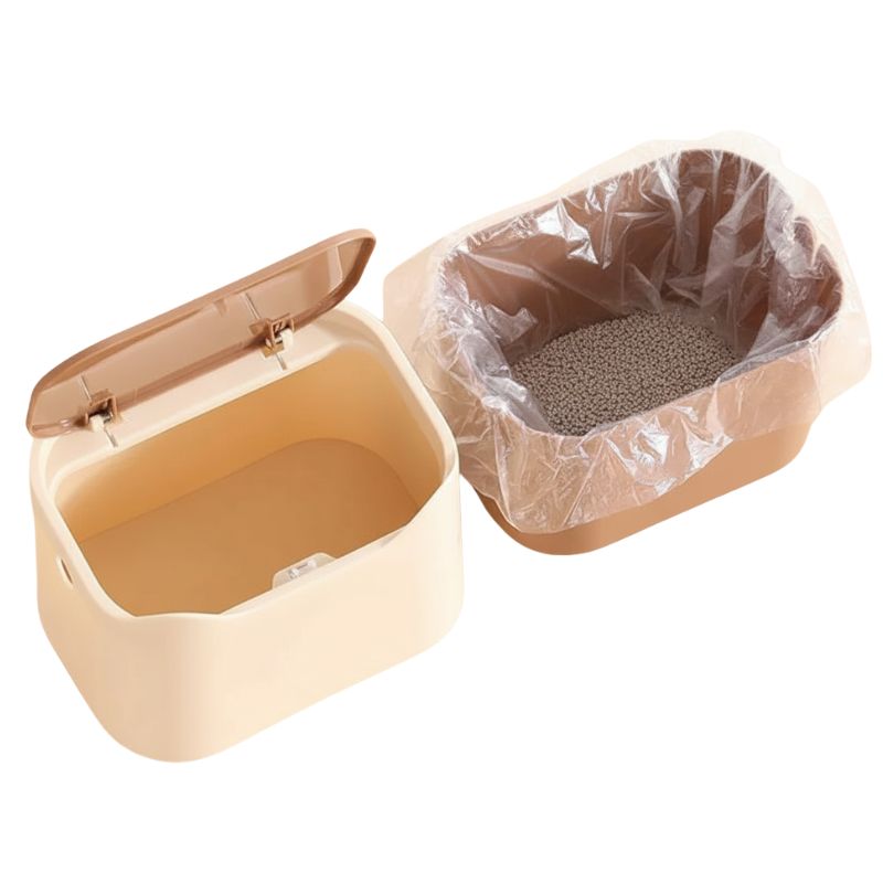 Beige pet litter box with a transparent plastic liner on a white background