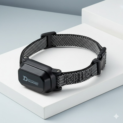 Black pet collar with a D-Guard device on a white surface