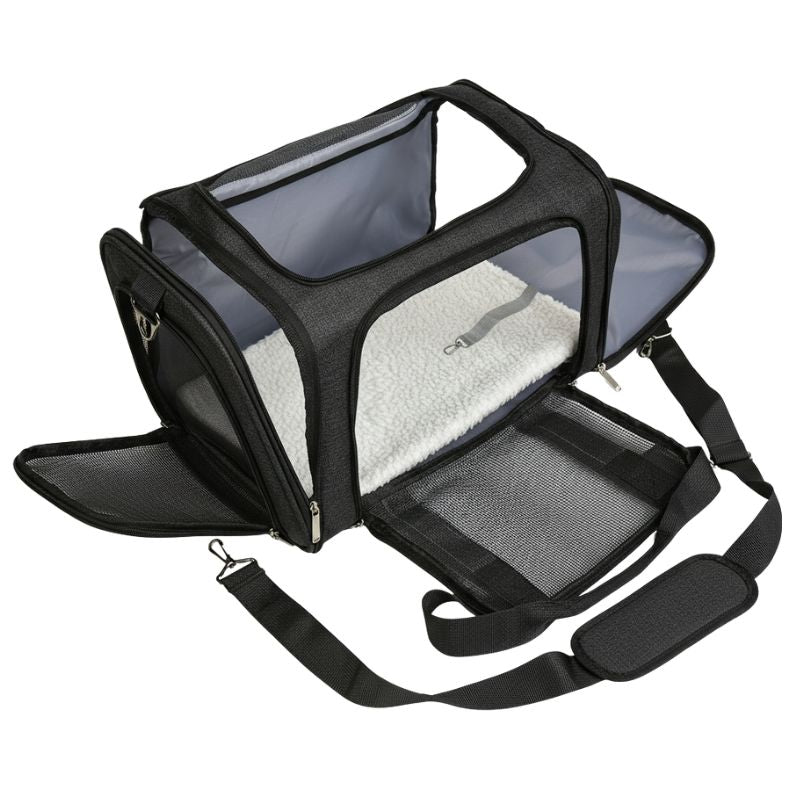 Pet carrier with mesh sides and a strap on a white background