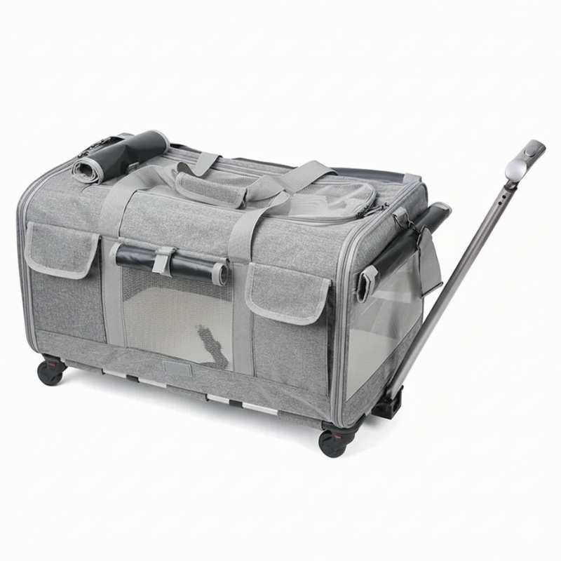 Gray pet travel crate with wheels and a handle on a white background