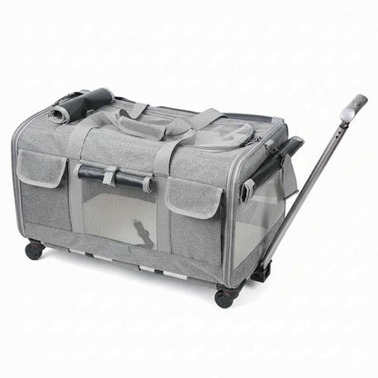 Gray pet travel crate with wheels and a handle on a white background