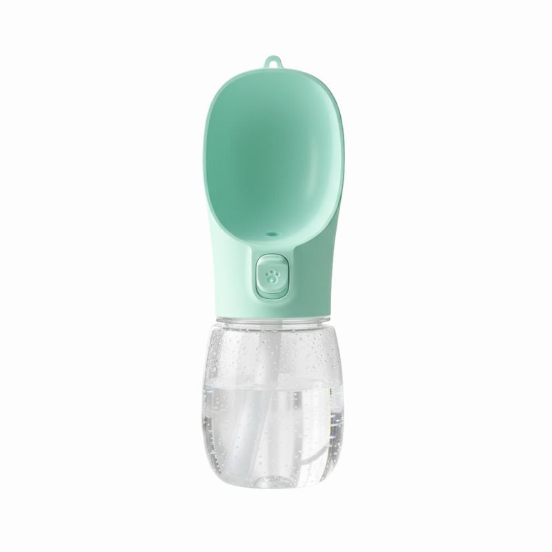 Portable pet water bottle with a green top and clear bottom on a white background
