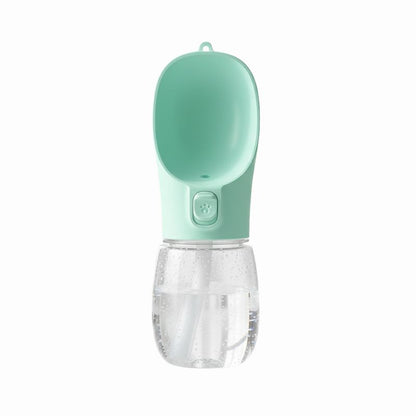 Portable pet water bottle with a green top and clear bottom on a white background