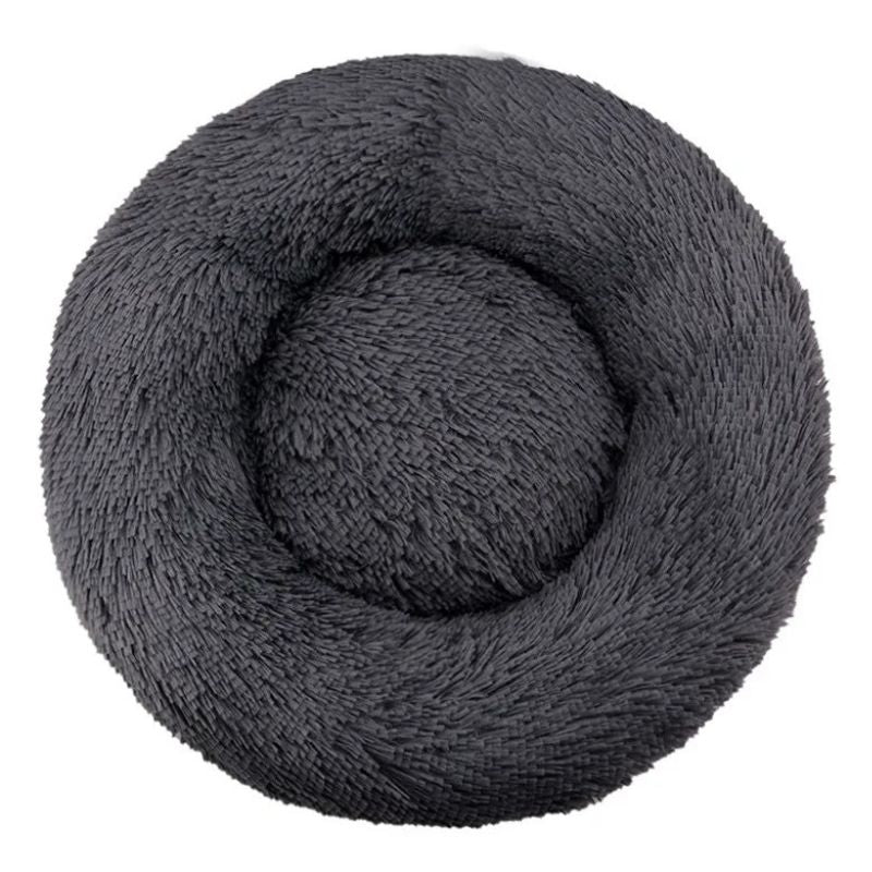Coiled gray plush blanket on a white background