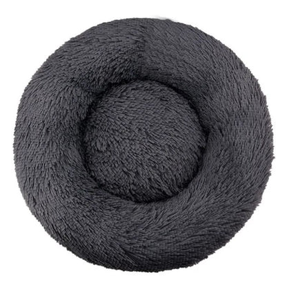 Coiled gray plush blanket on a white background